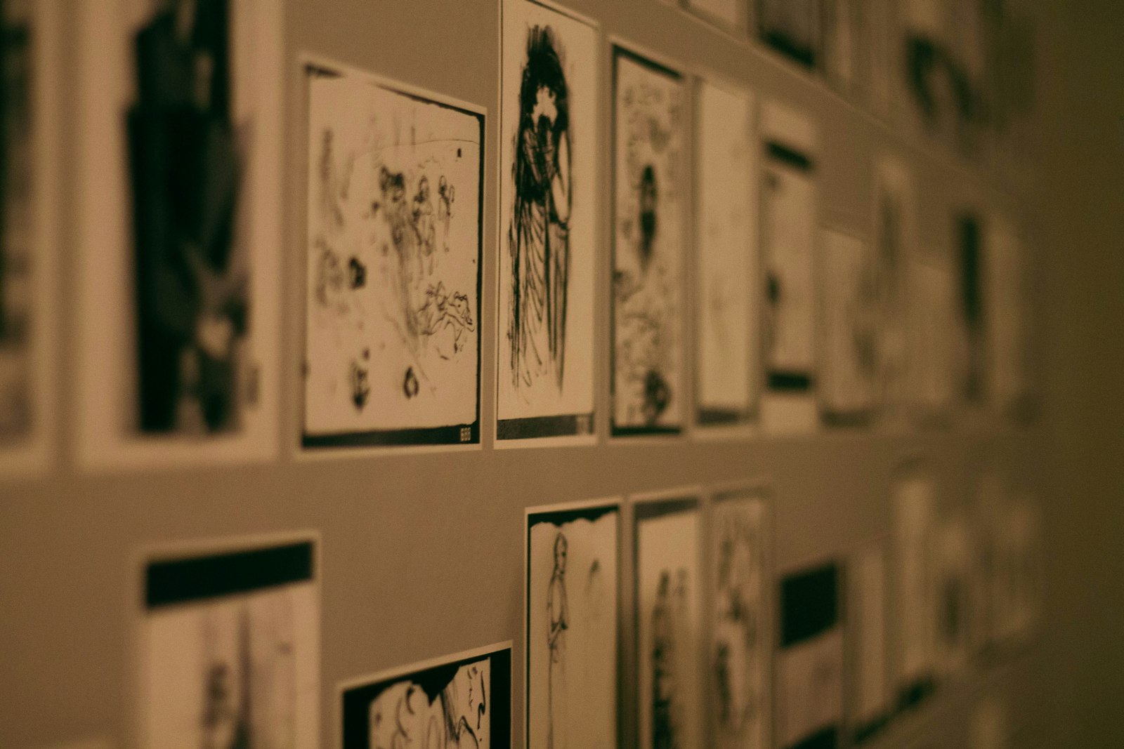 a bunch of pictures are hanging on a wall