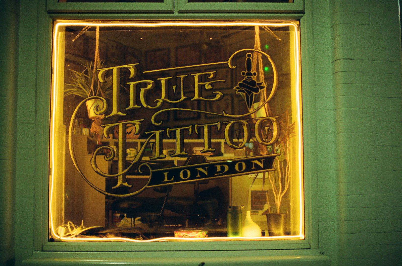 True tattoo london shop window at night