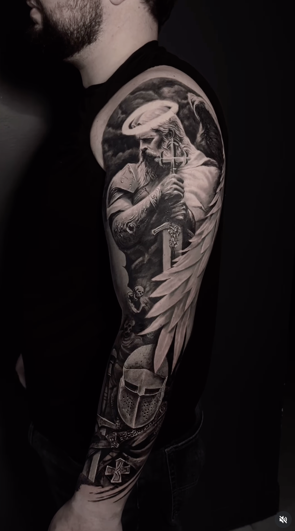 A tattoo artist is giving a tattoo.